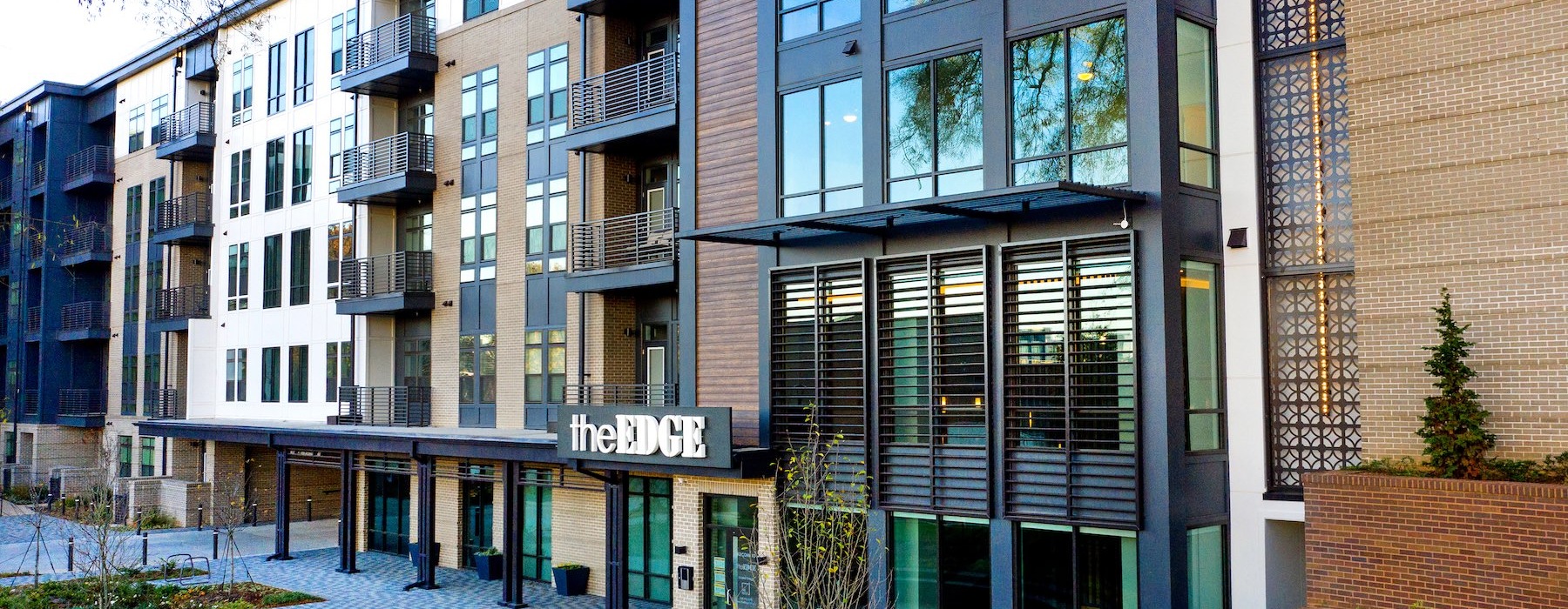 an apartment building with large windows