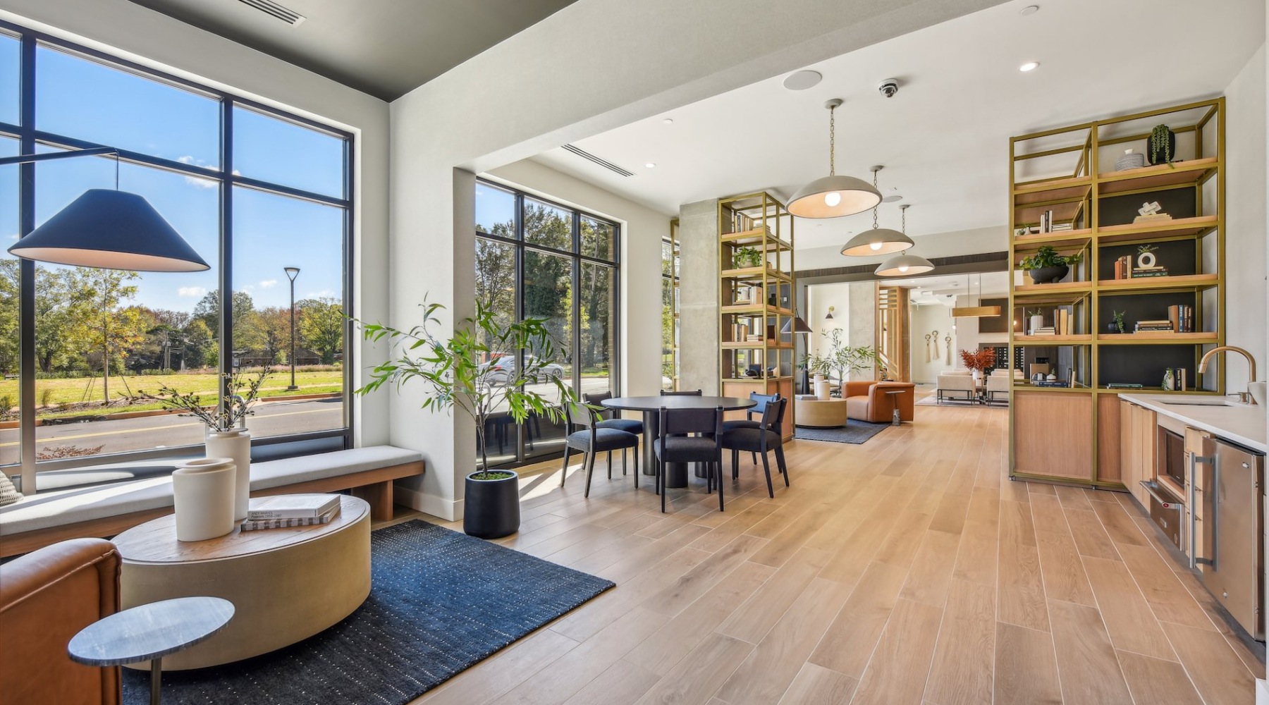 a spacious clubhouse with natural light and ample seating