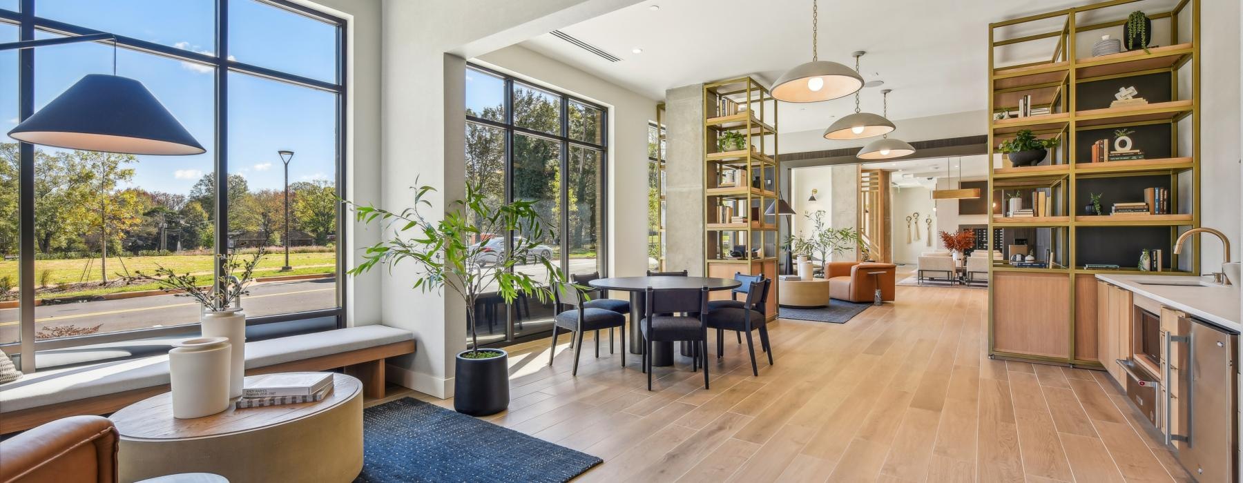 a room with a bar and chairs