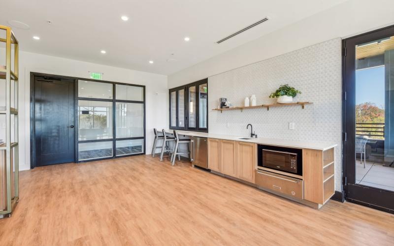 a kitchen with a large glass door